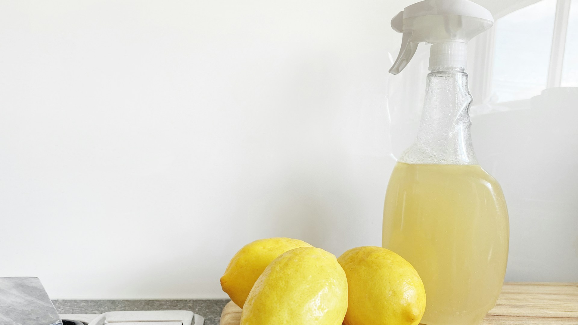 yellow lemon fruit beside clear glass bottle