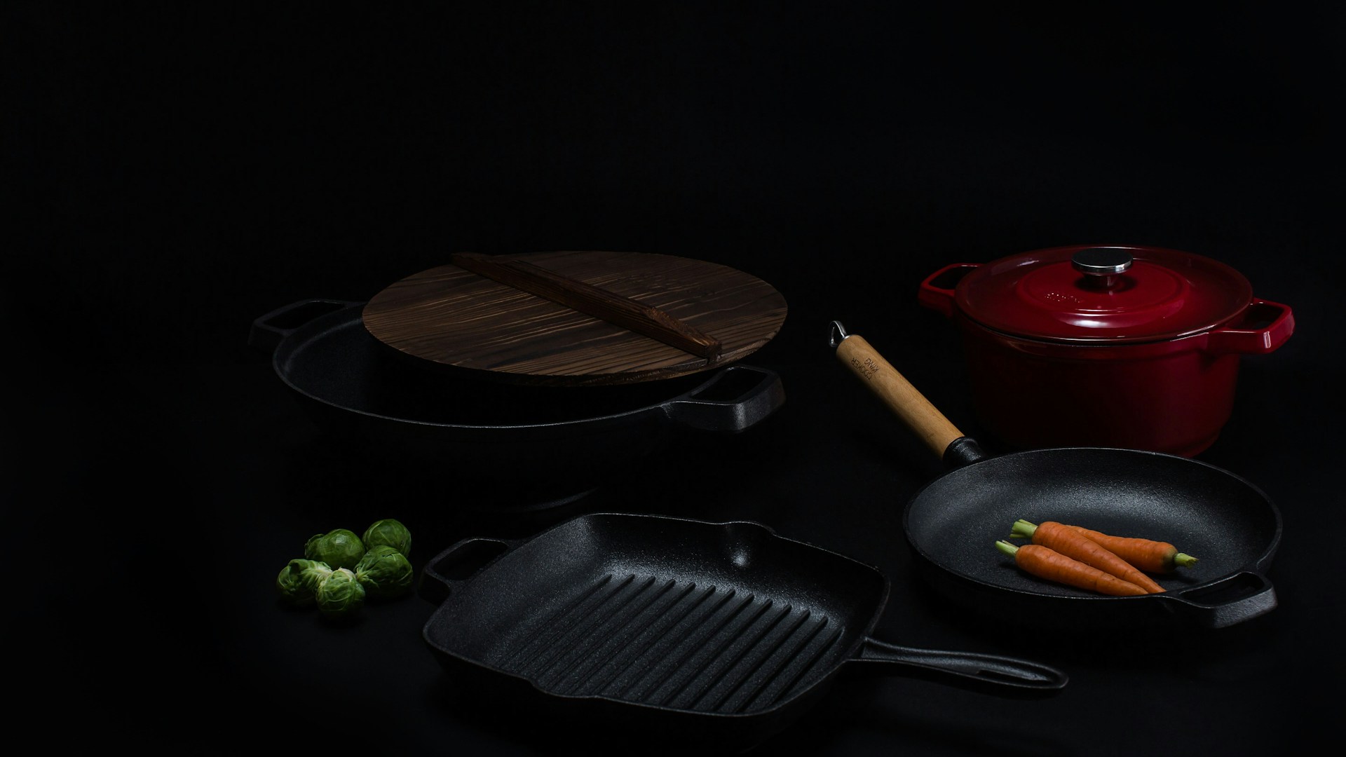 brown wooden round chopping board beside black frying pan