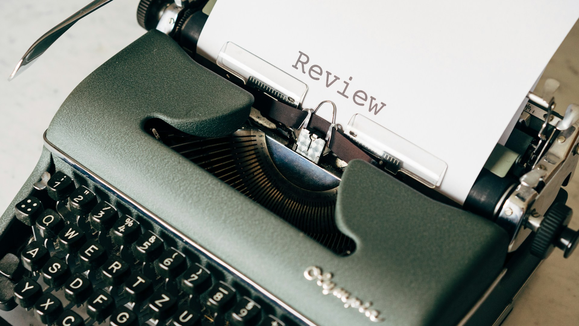 black and white typewriter on white table