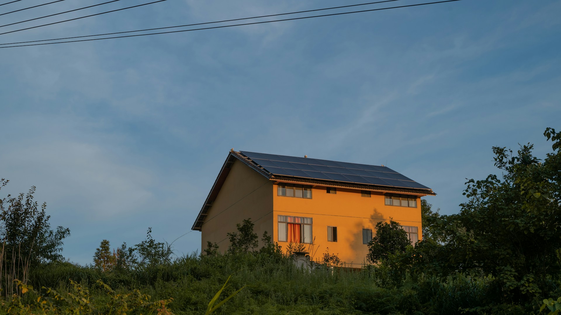 A house with a solar panel on the roof